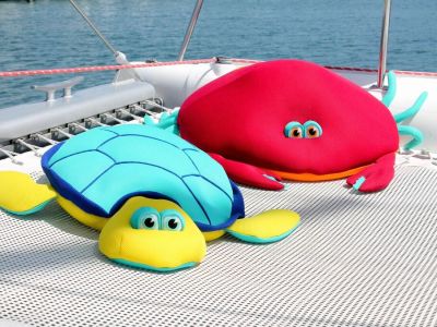 stuffed animal water toys on catamaran
