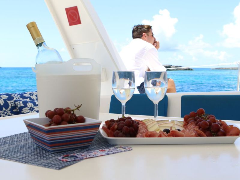 wine and snacks on board a catamaran