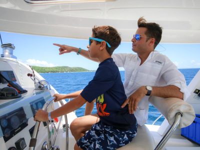 man and boy sailing catamaran on Puerto Rico waters