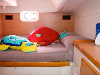 stuffed animals on bed in catamaran