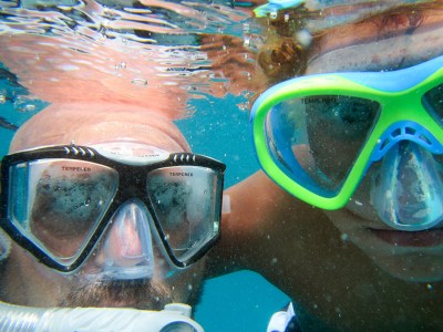 People snorkeling in masks