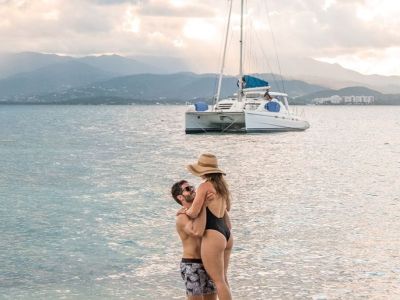 a person standing next to a body of water