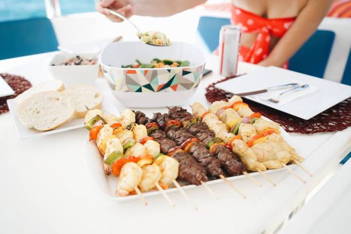 a white plate topped with different types of food on a table